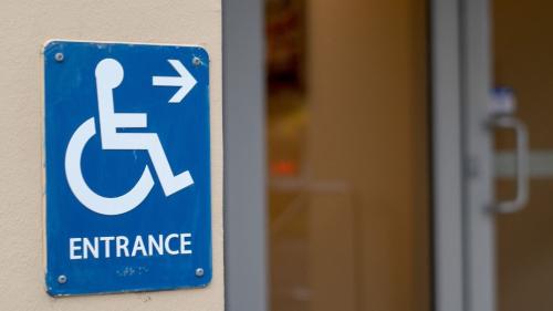 Accessible entrance sign and door