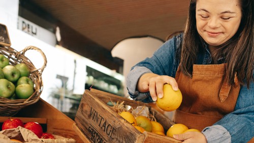 Young woman stocking lemons