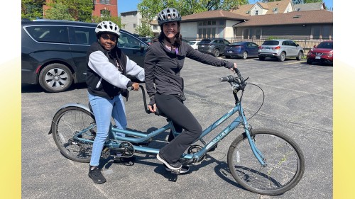 Jenny Achuthan and member on a tandem bike