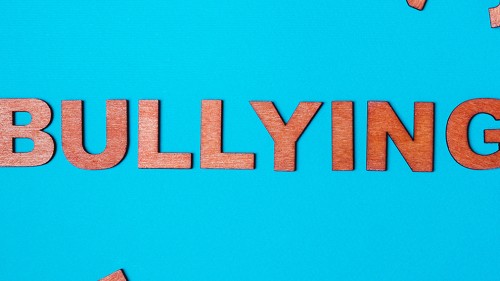 Bullying spelled out in wooden letters