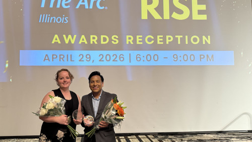 Envision staff members celebrate at an award ceremony.