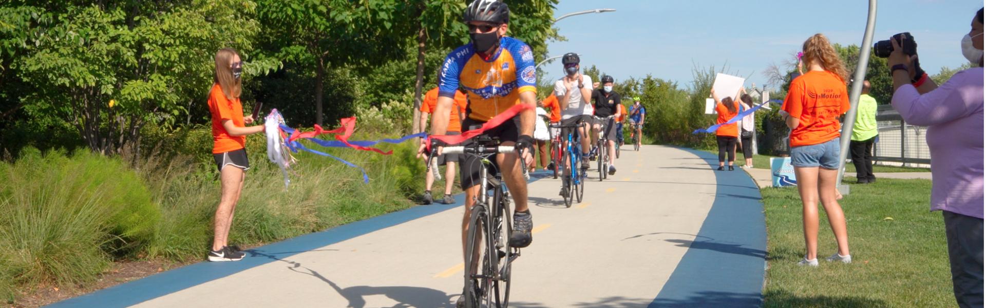 Tim crosses the finish line