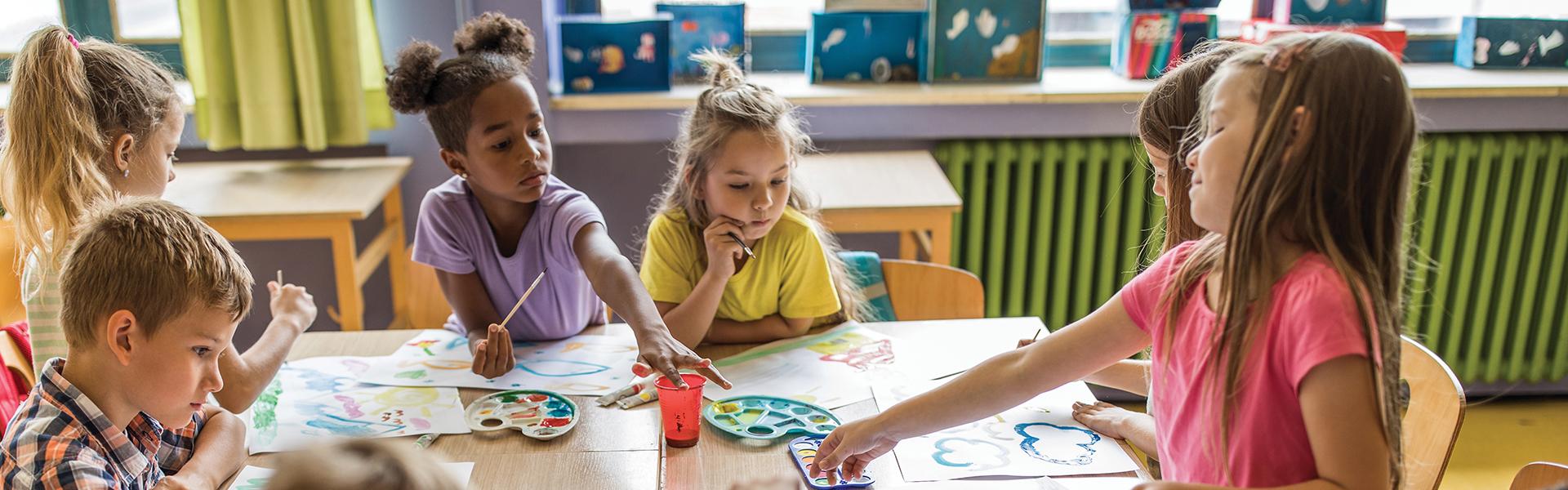 Children paint with watercolors