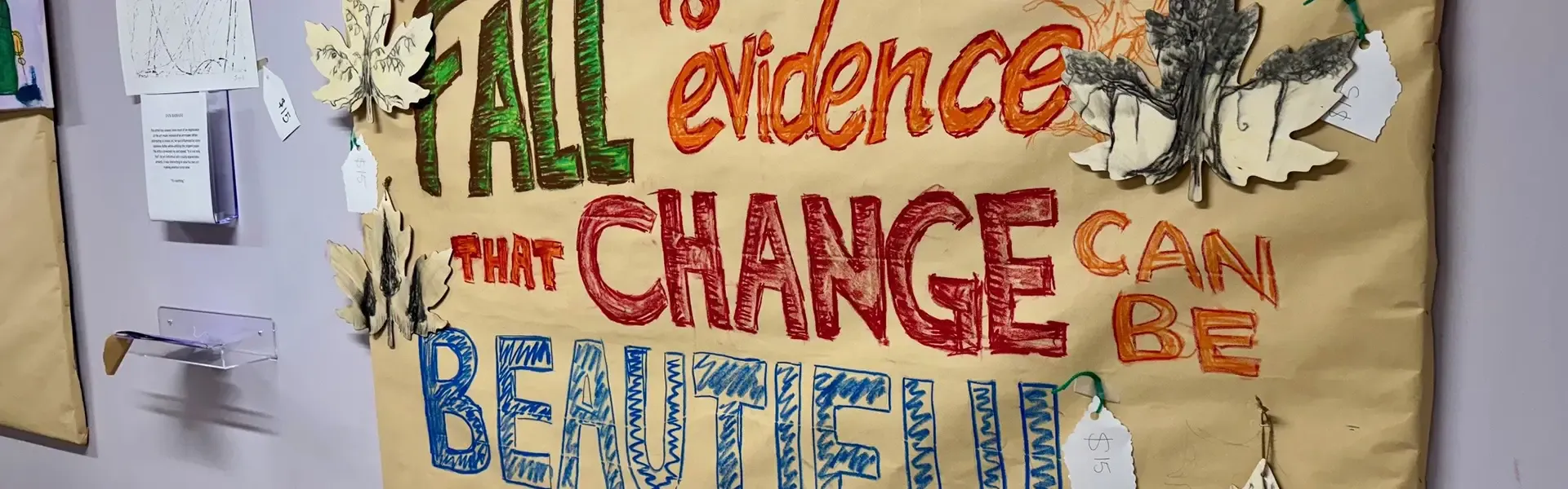 A colorful poster that says, 'Fall is evidence that change can be beautiful.'