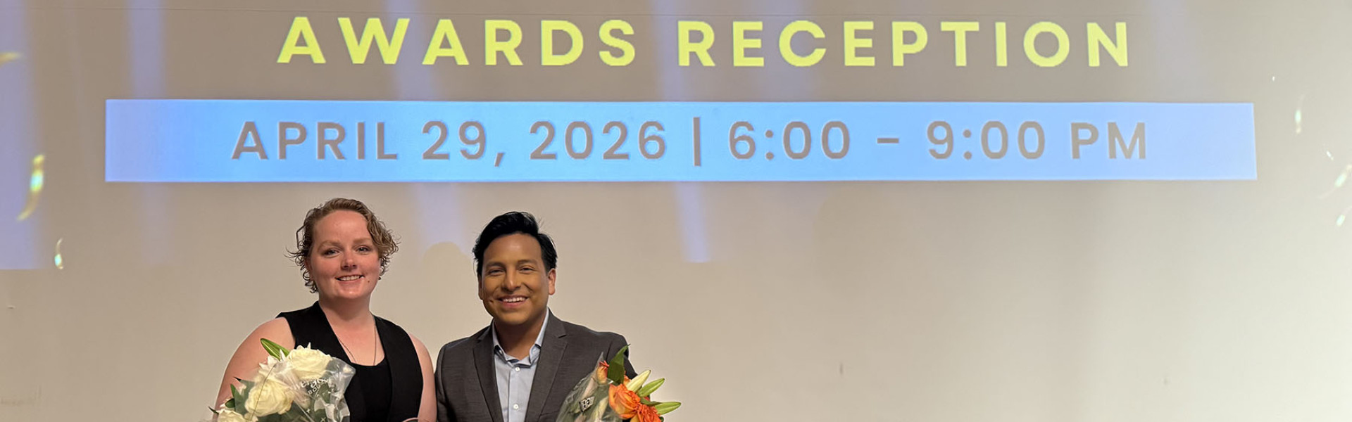 Envision staff members celebrate at an award ceremony.