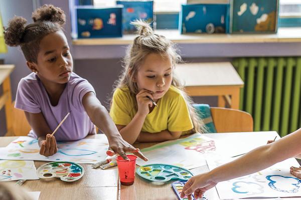 Children paint with watercolors