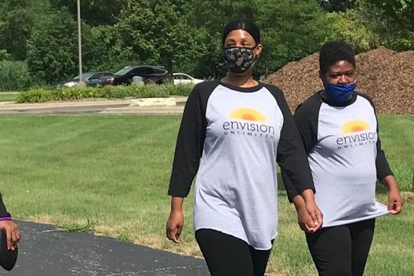 Members walking in their park for their pledge 