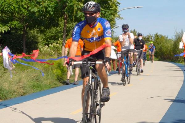 Tim crosses the finish line