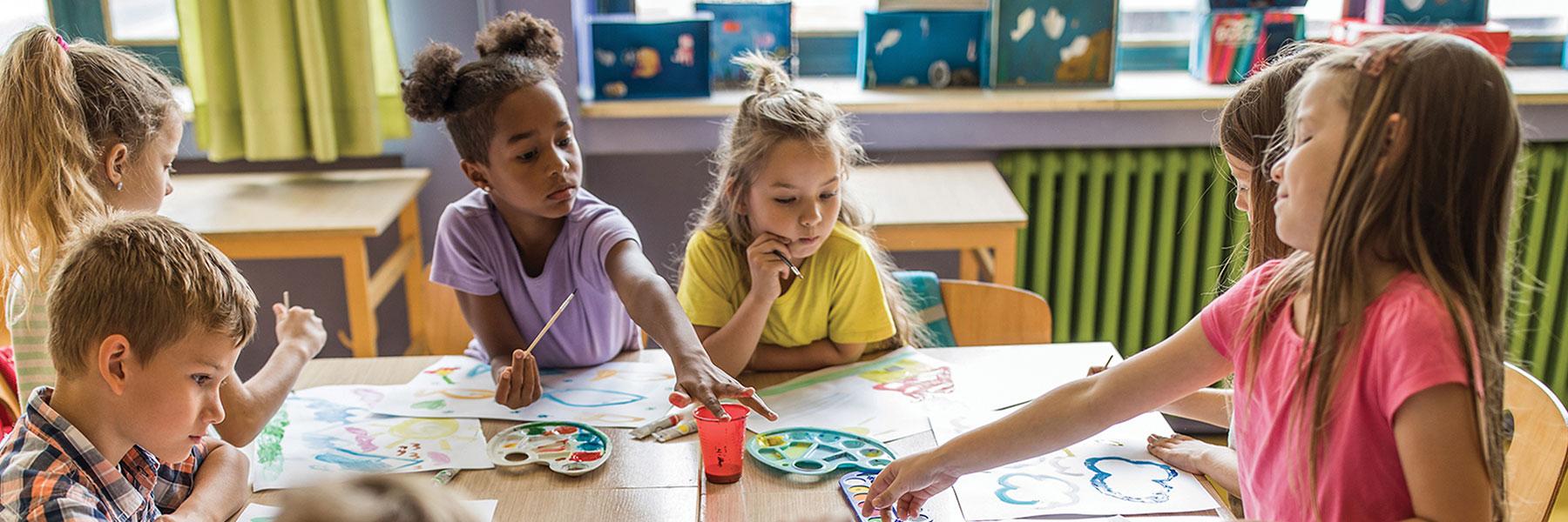 Children paint with watercolors