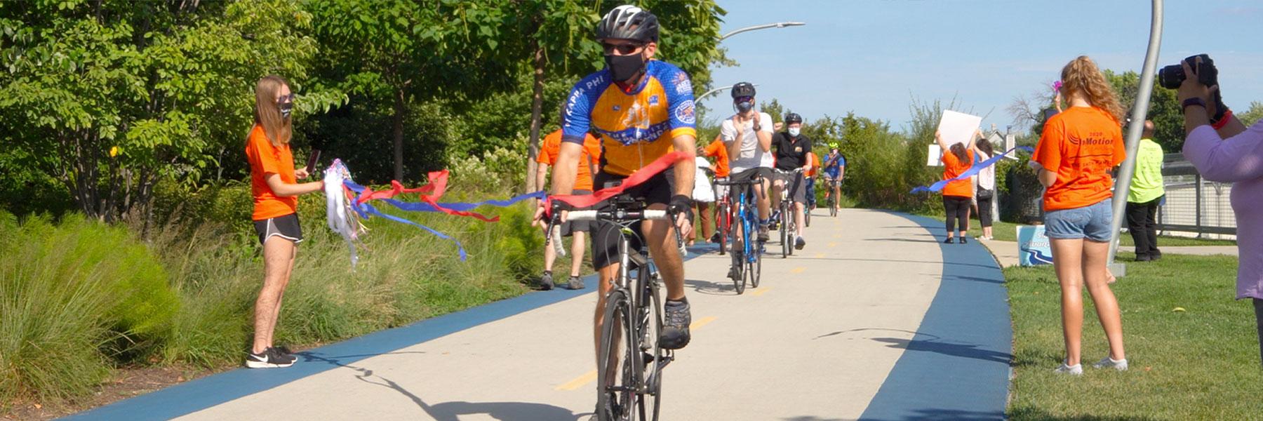 Tim crosses the finish line