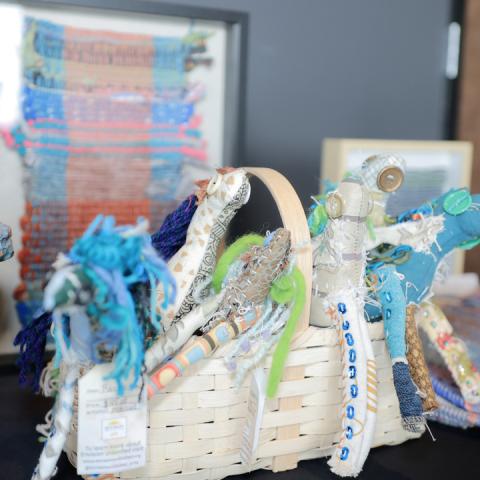 A display of handmade, colorful woven art