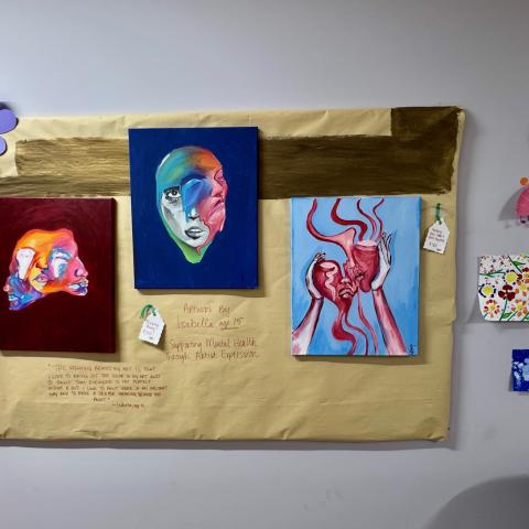 Colorful artwork on a wall.