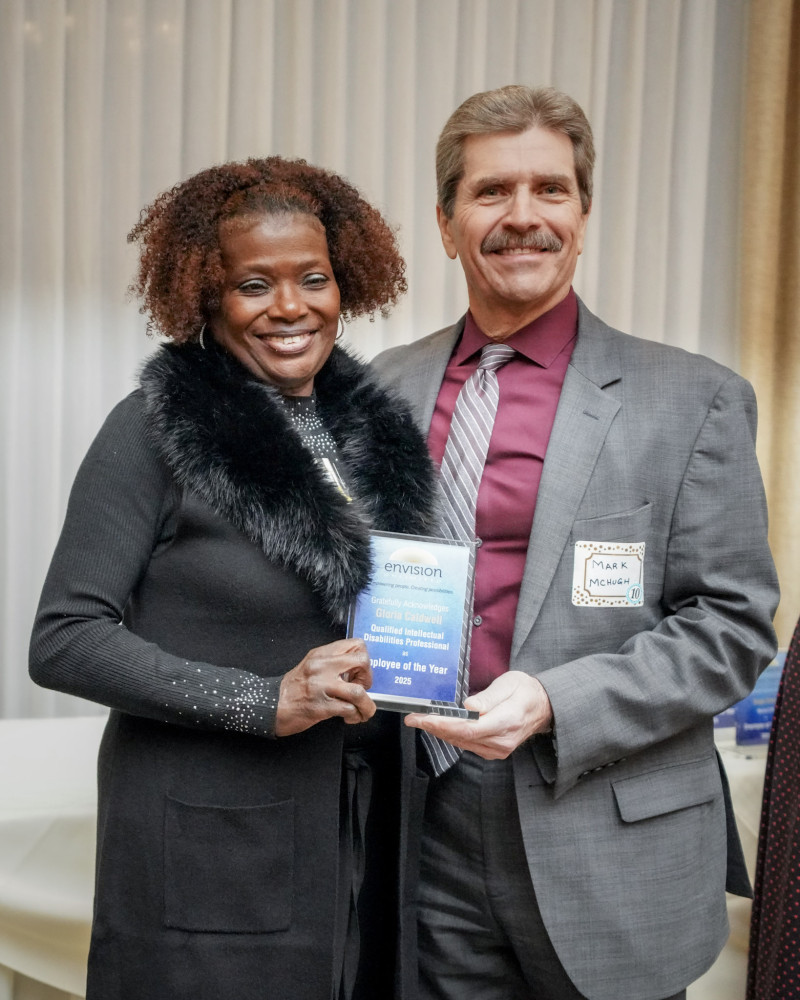 Employee of the Year (2025) Gloria Caldwell with President and CEO Mark McHugh