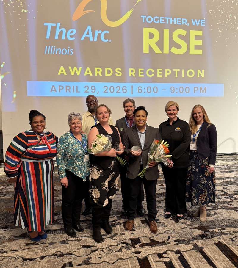 Envision staff members celebrate award recipients at a recent conference.