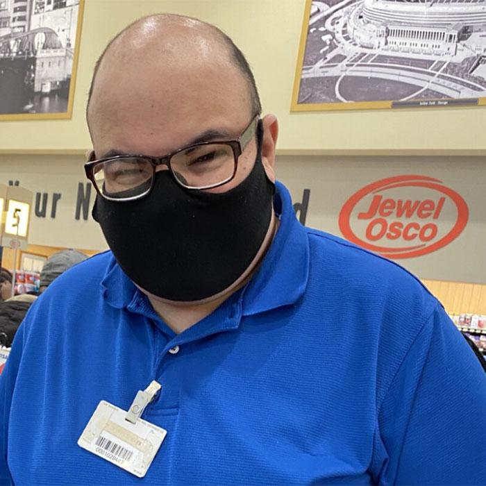 Joel wearing his mask at work