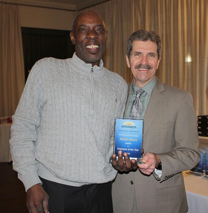 Michael Winters accepts his award from Mark McHugh