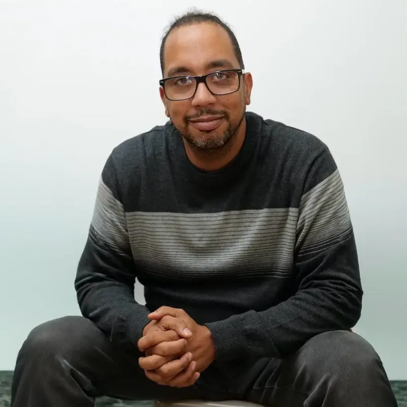 A portrait of a man against a white background
