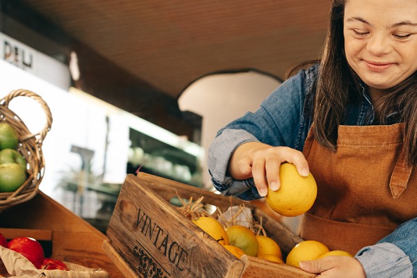 Young woman stocking lemons