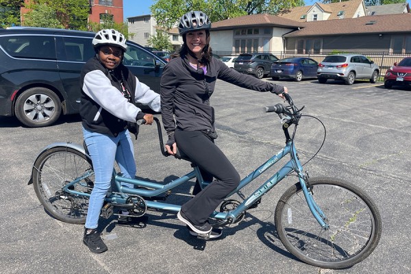 Jenny Achuthan and member on a tandem bike
