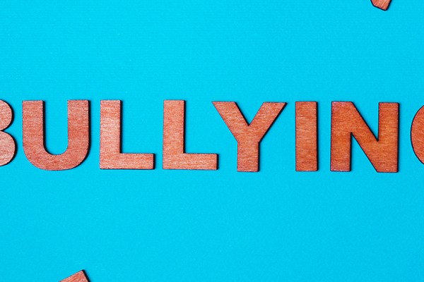 Bullying spelled out in wooden letters