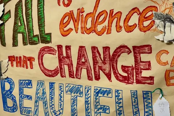 A colorful poster that says, 'Fall is evidence that change can be beautiful.'