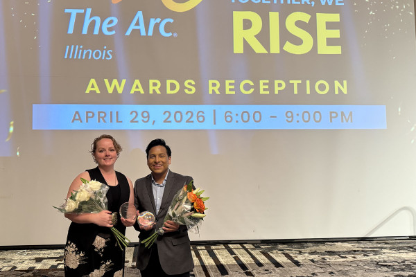 Envision staff members celebrate at an award ceremony.